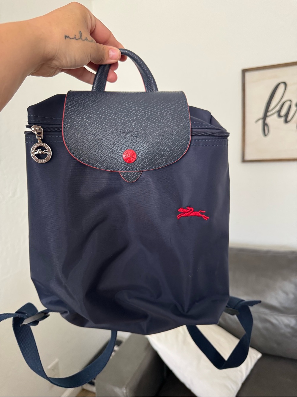 Longchamp navy backpack with red accents